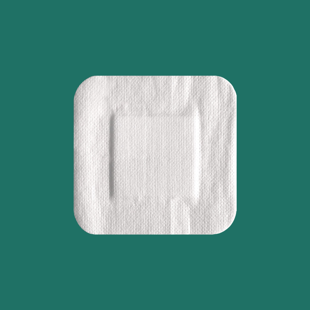 Adhesive non-woven wound dressing 